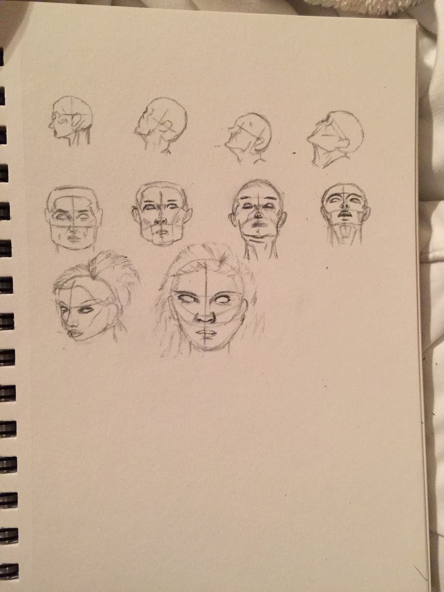 A spiral sketchbook page of pencil heads: a row of four in profile, a row of four turning toward the viewer, and two larger finished faces below.